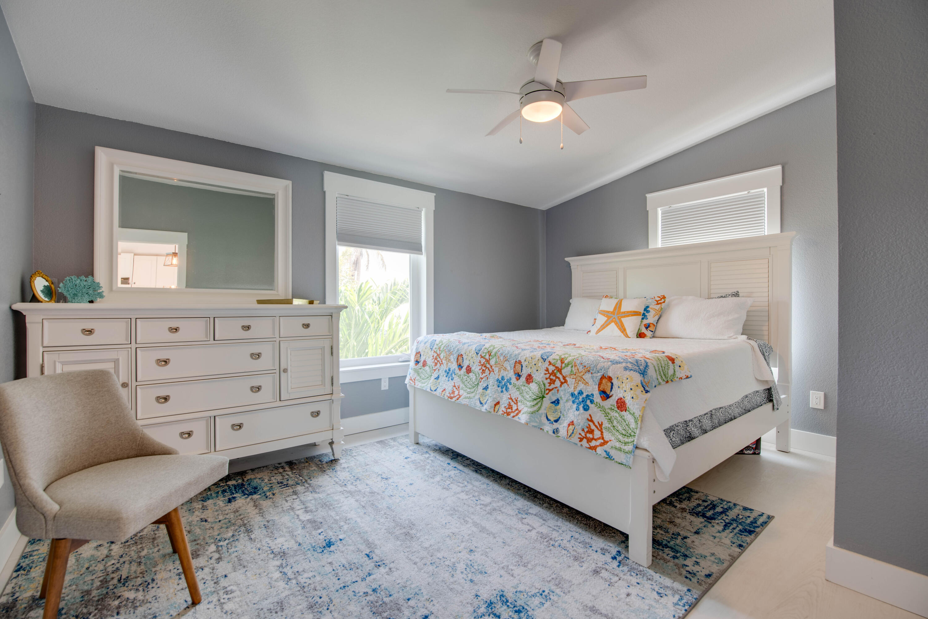 930 80th Street Marathon, FL 33050 - Photo 15 of 49 a bedroom with a bed a chandelier and dresser