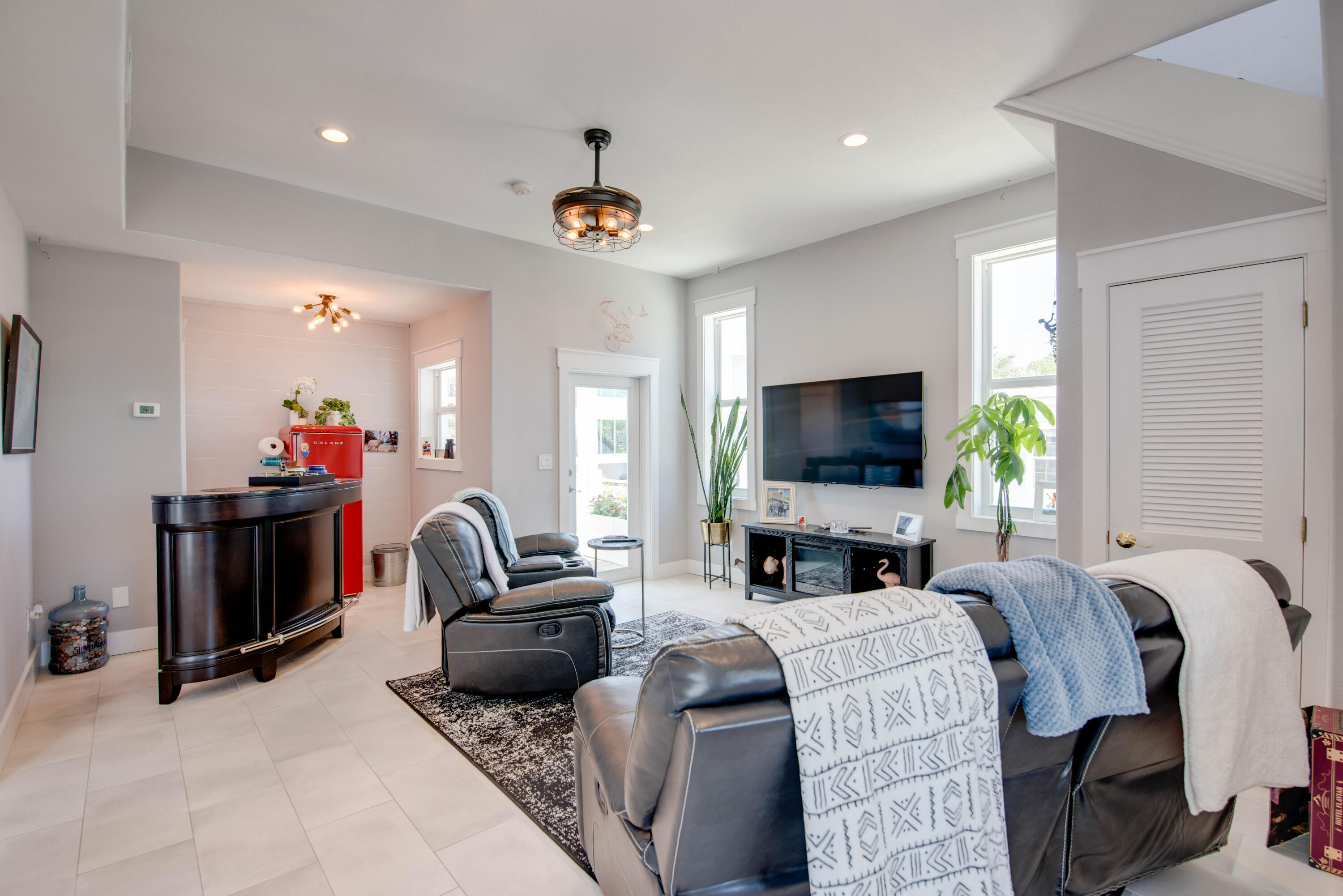 930 80th Street Marathon, FL 33050 - Photo 21 of 49 a living room with furniture a flat screen tv and a fireplace