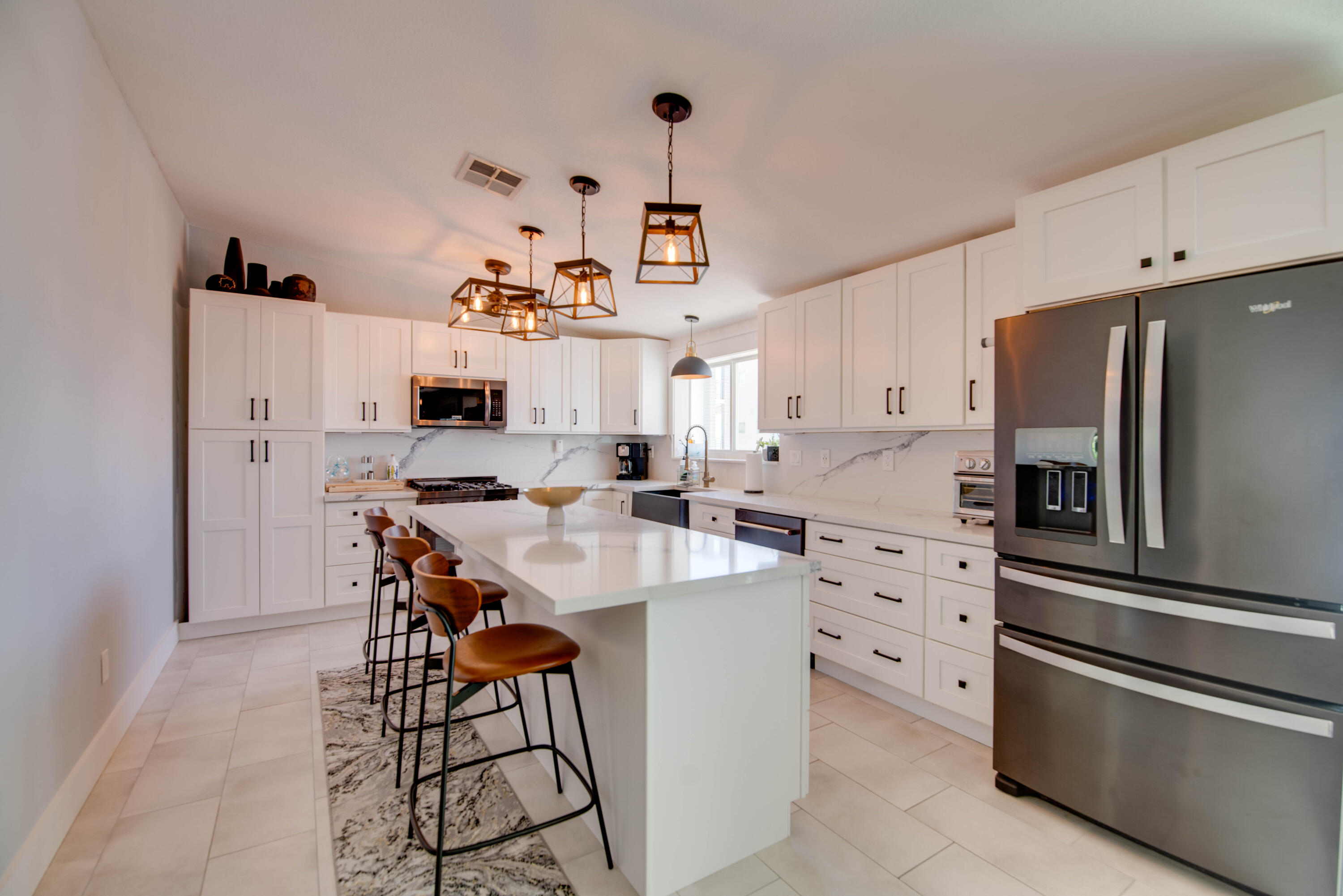 930 80th Street Marathon, FL 33050 - Photo 3 of 49 a kitchen with stainless steel appliances a refrigerator stove microwave and cabinets