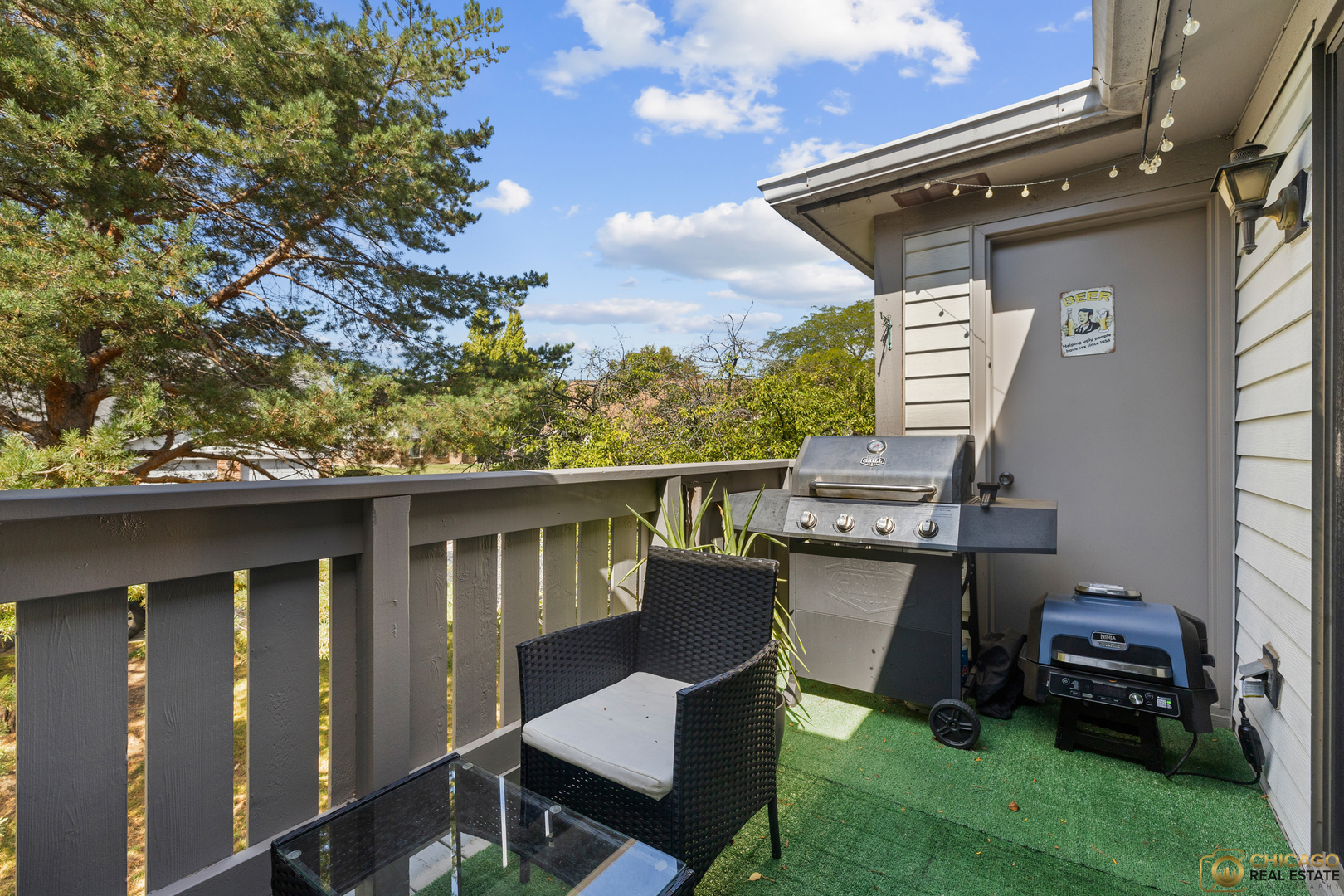 1631 West Partridge Court, Unit 8 Arlington Heights, IL 60004 - Photo 23 of 26 a view of a deck with chairs and a barbeque