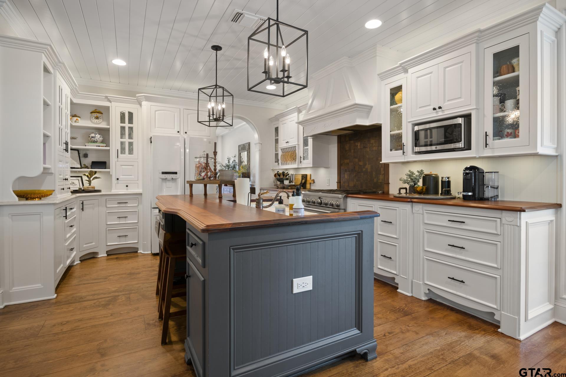 134 Private Road New Boston, TX 75570 - Photo 11 of 40 a kitchen with stainless steel appliances granite countertop a sink a stove top oven a counter space and cabinets