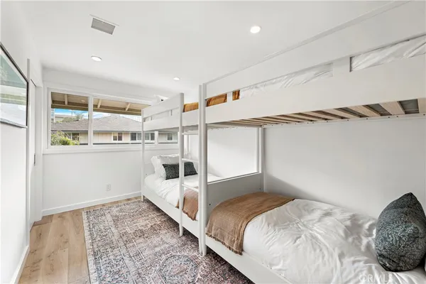 a bedroom with a bed and the view of kitchen