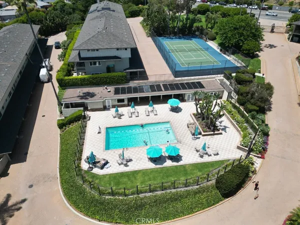 an aerial view of a house with outdoor space