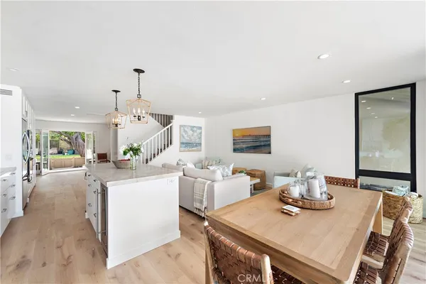 a living room with kitchen island furniture and a table