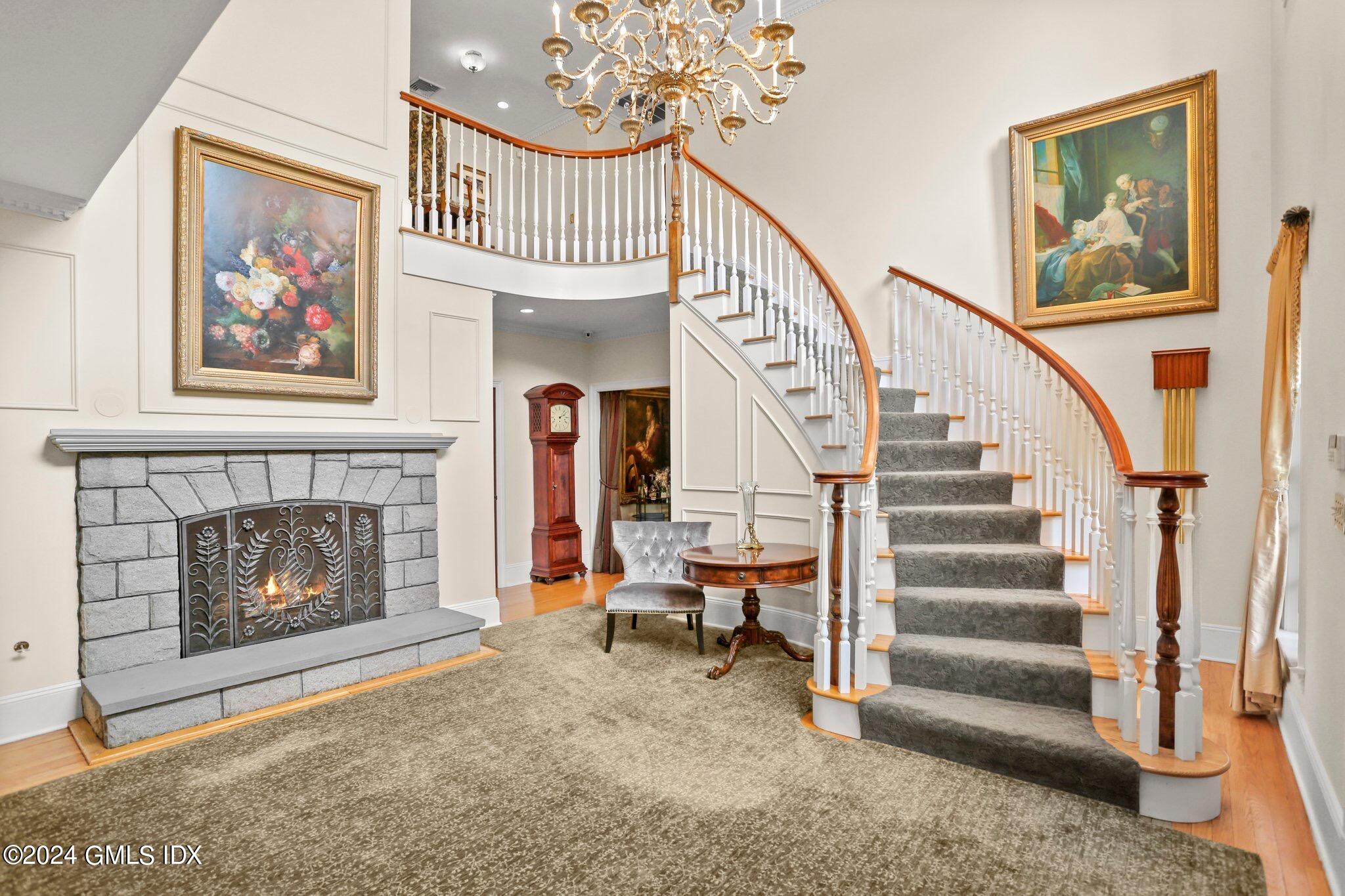 376 Westover Road Stamford, CT 06902 - Photo 5 of 37 a living room with furniture and a fireplace