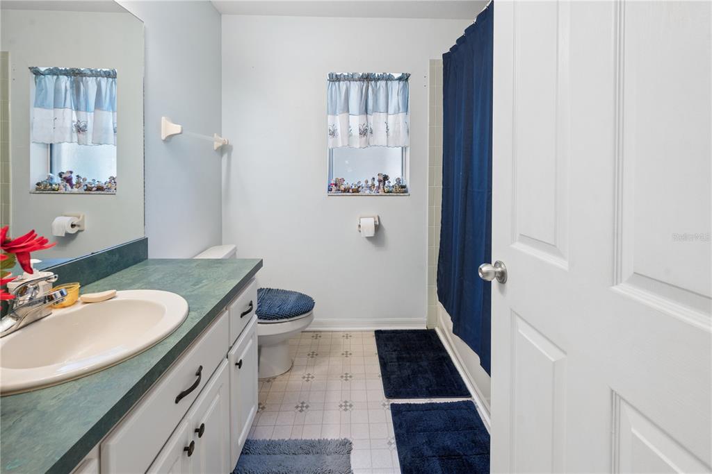 1750 Southwest 15th Street Bell, FL 32619 - Photo 21 of 34 a bathroom with a sink and a mirror