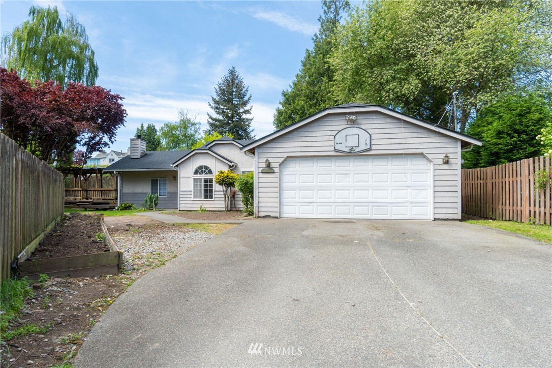10837 4th Avenue South Seattle, WA 98168 - Photo 1 of 25 a front view of a house with a yard and garage