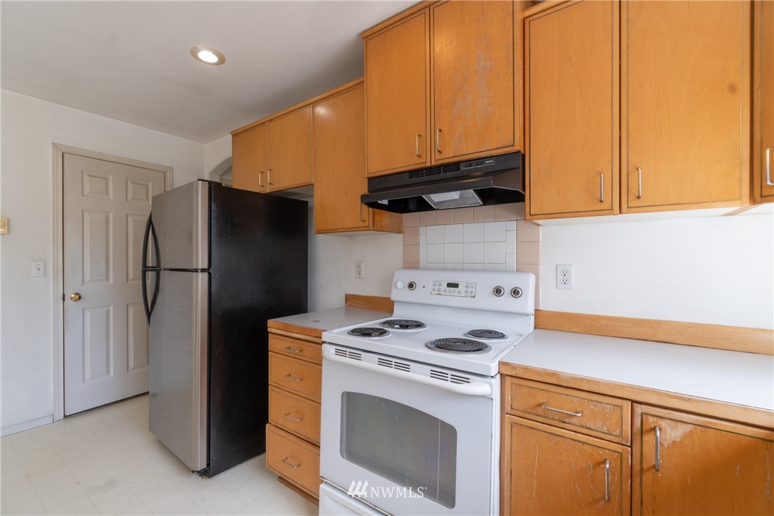 10837 4th Avenue South Seattle, WA 98168 - Photo 13 of 25 a kitchen with a refrigerator sink and cabinets