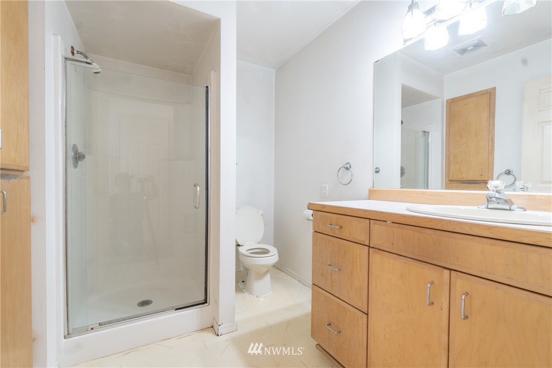 10837 4th Avenue South Seattle, WA 98168 - Photo 19 of 25 a bathroom with a sink a toilet and shower