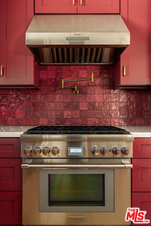 4841 Don Pio Drive Woodland Hills, CA 91364 - Photo 11 of 20 a stove top oven sitting inside of a kitchen