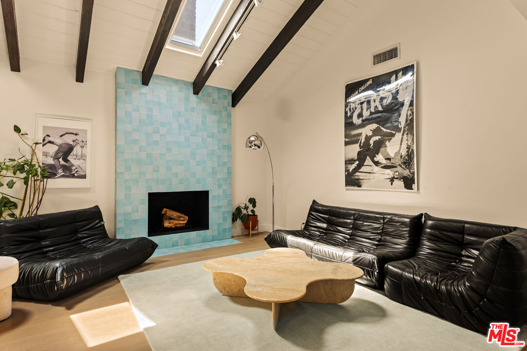 4841 Don Pio Drive Woodland Hills, CA 91364 - Photo 12 of 20 a bedroom with furniture and a fireplace