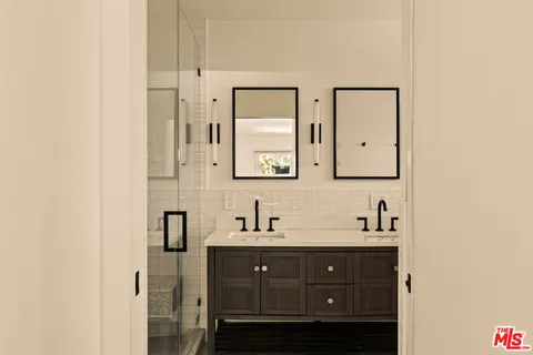 a bathroom with a sink a toilet and bathtub