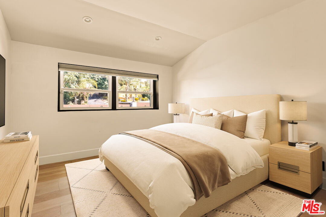 4841 Don Pio Drive Woodland Hills, CA 91364 - Photo 16 of 20 a bedroom with bed and a night stand