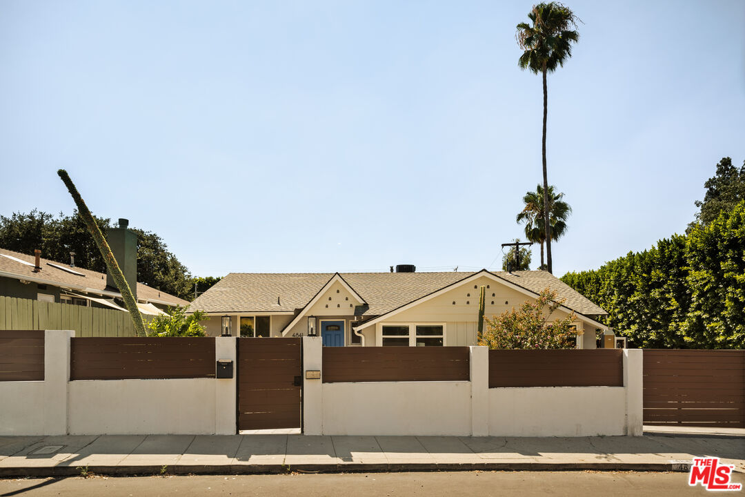 4841 Don Pio Drive Woodland Hills, CA 91364 - Photo 19 of 20 a view of a street in the middle of a yard
