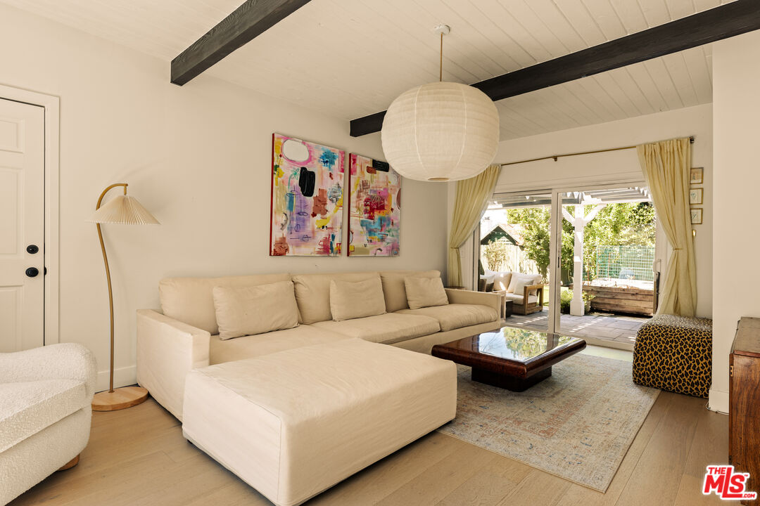 4841 Don Pio Drive Woodland Hills, CA 91364 - Photo 4 of 20 a living room with furniture and a large window