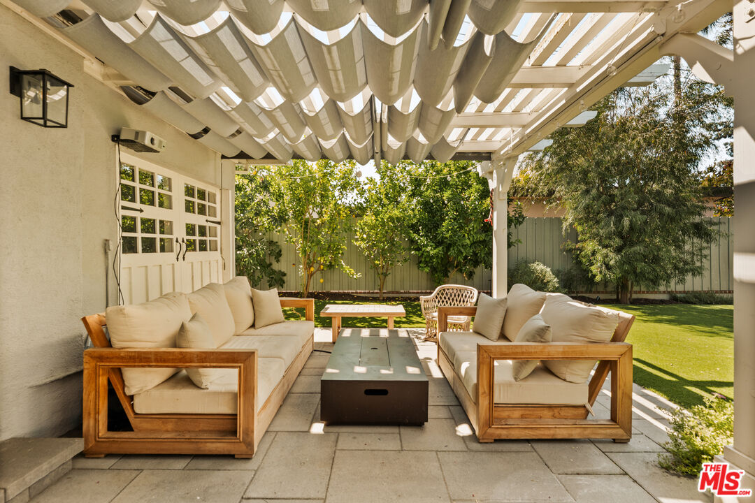 4841 Don Pio Drive Woodland Hills, CA 91364 - Photo 5 of 20 a outdoor space with patio furniture and a fireplace