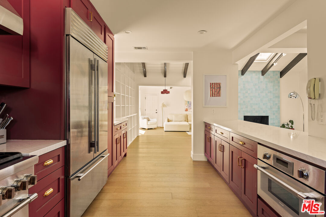 4841 Don Pio Drive Woodland Hills, CA 91364 - Photo 9 of 20 a kitchen with stainless steel appliances a stove and a refrigerator