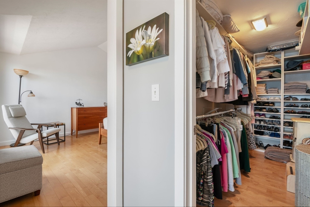 66 Glades Road, Unit 8 Scituate, MA 02066 - Photo 18 of 27 a view of walk in closet with clothes and shoes