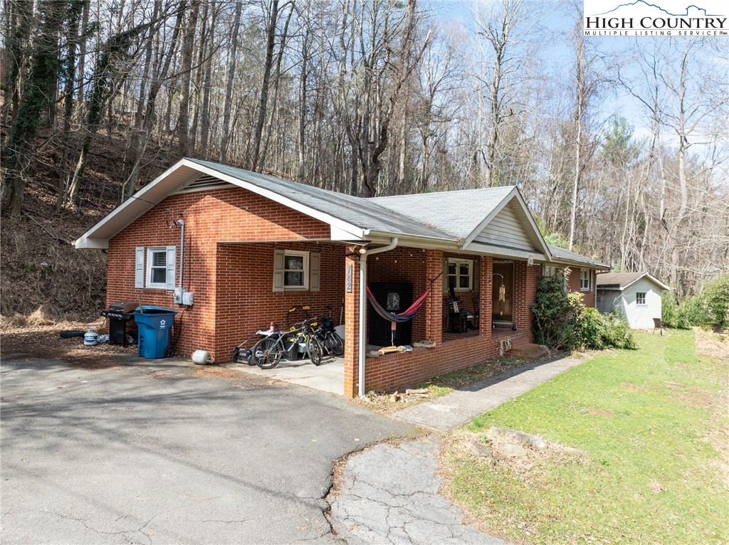 182 Owens Drive Boone, NC 28607 - Photo 18 of 20 a front view of a house with a yard outdoor seating and garage