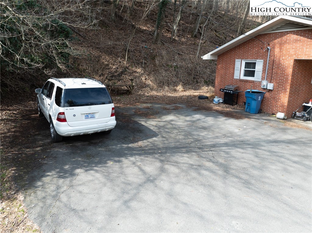 182 Owens Drive Boone, NC 28607 - Photo 19 of 20 a car parked in front of white house