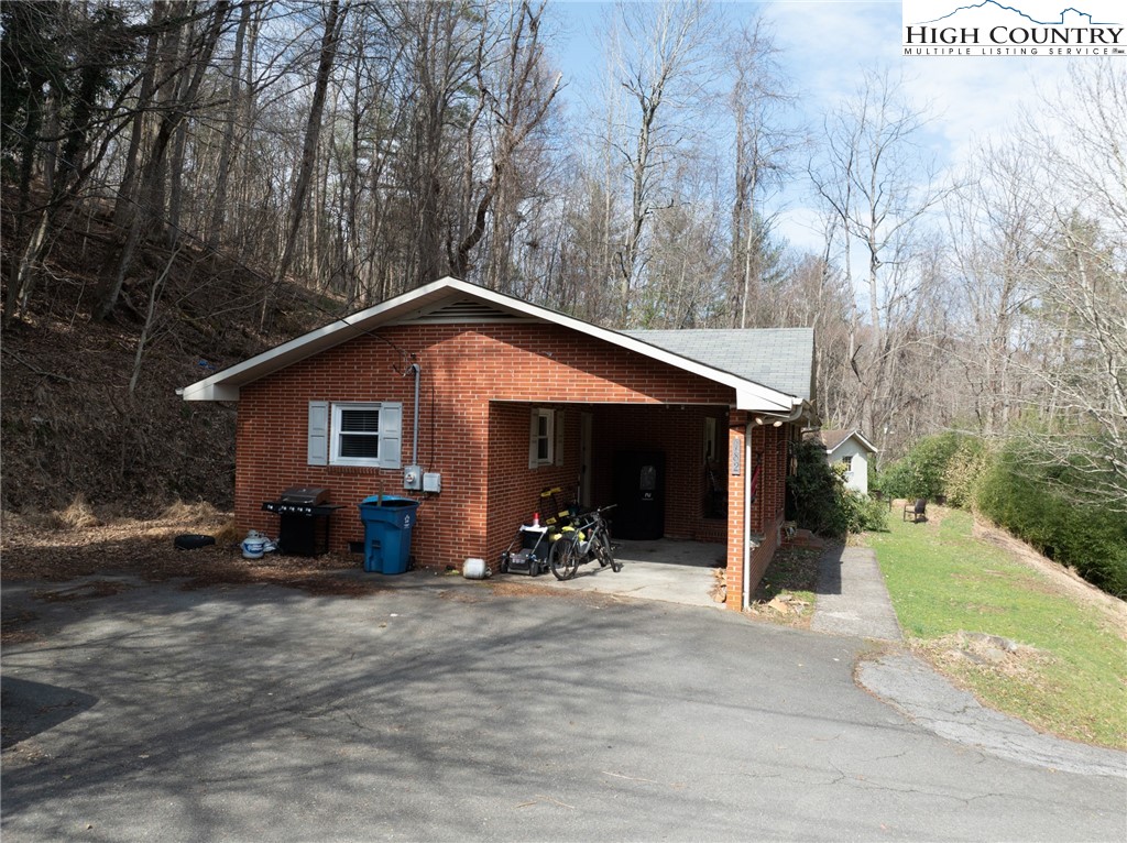 182 Owens Drive Boone, NC 28607 - Photo 20 of 20 a view of a house with yard and sitting area