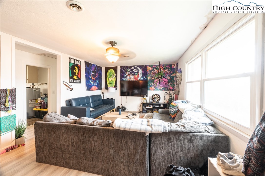 182 Owens Drive Boone, NC 28607 - Photo 7 of 20 a living room with furniture and a flat screen tv