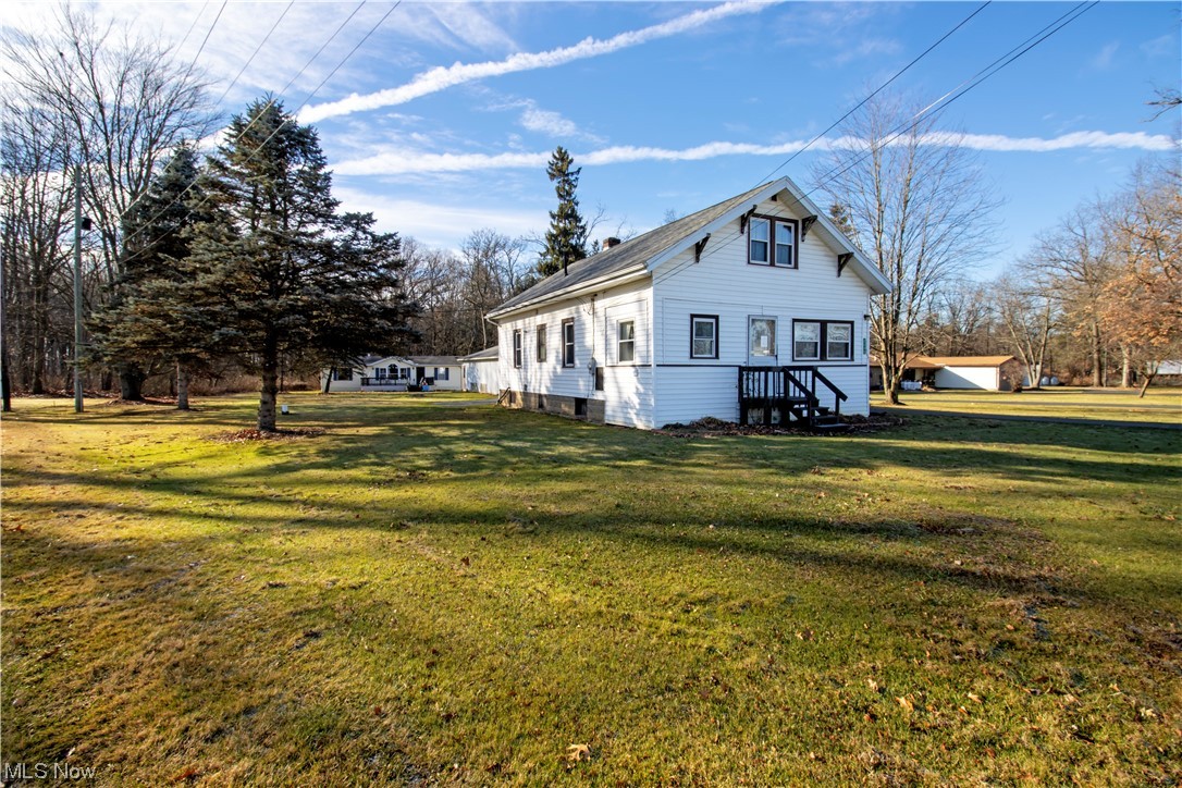 3233 Dover Road Wooster, OH 44691 - Photo 9 of 30 Rear view of house featuring a lawn