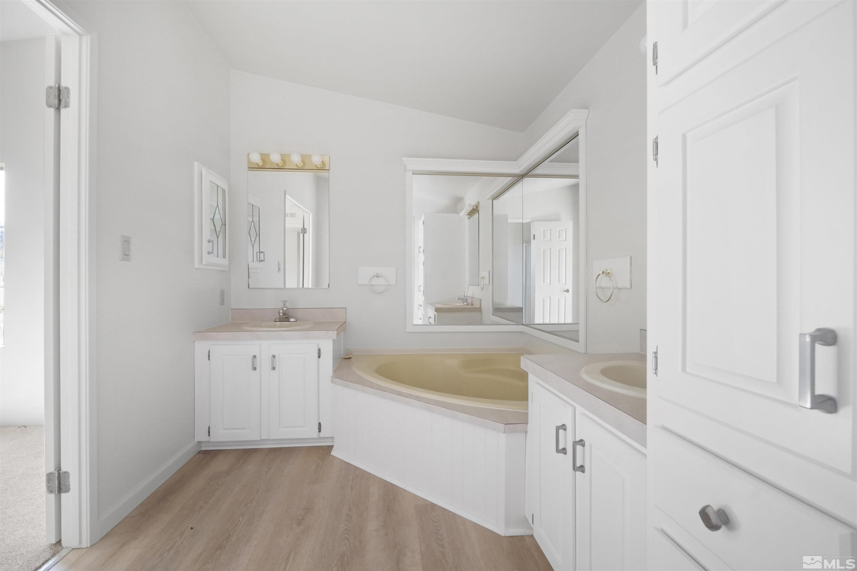15095 Pinion Drive Reno, NV 89521 - Photo 13 of 18 a bathroom with a tub sink and mirror
