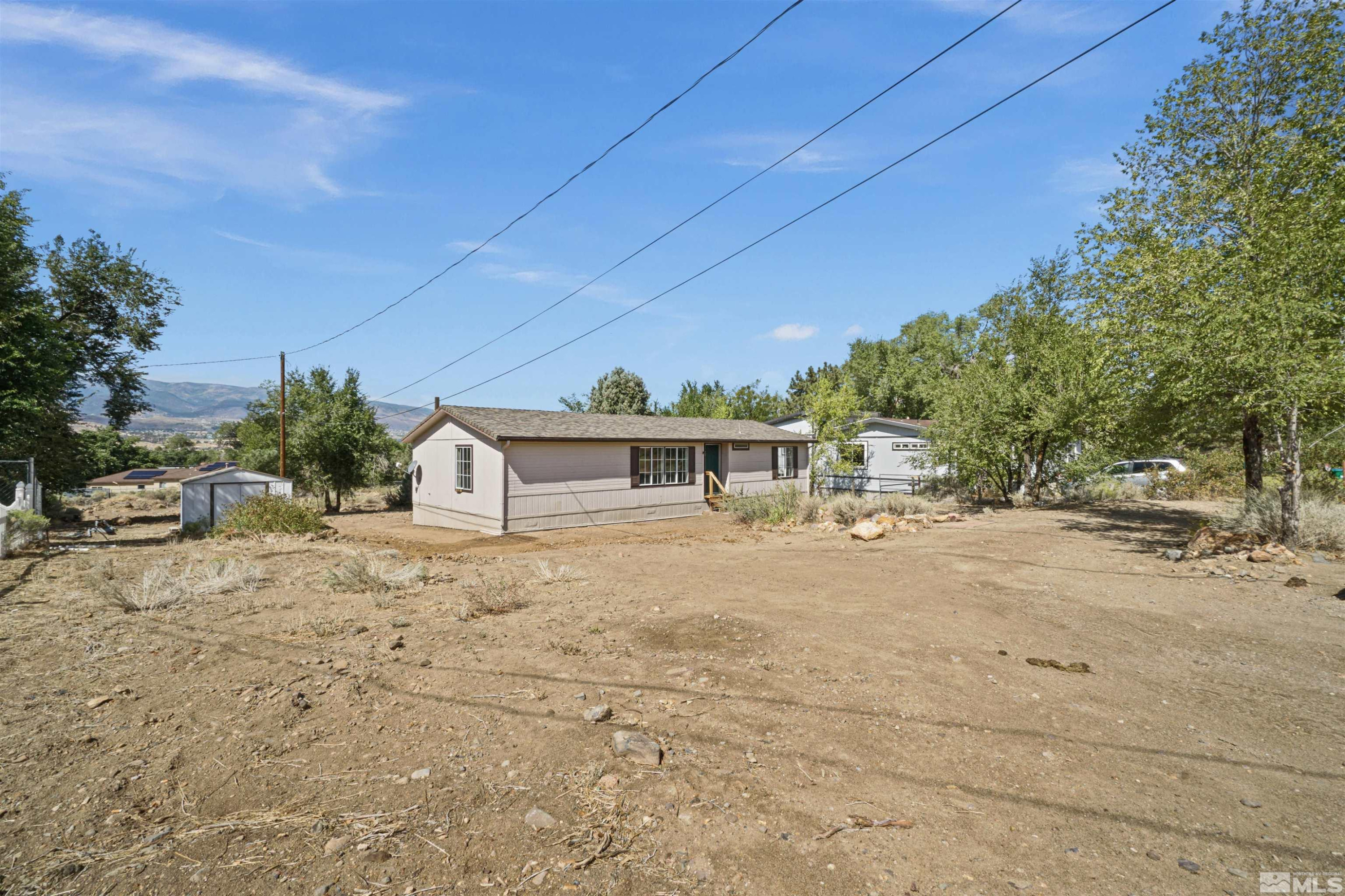 15095 Pinion Drive Reno, NV 89521 - Photo 16 of 18 a view of a house with a yard