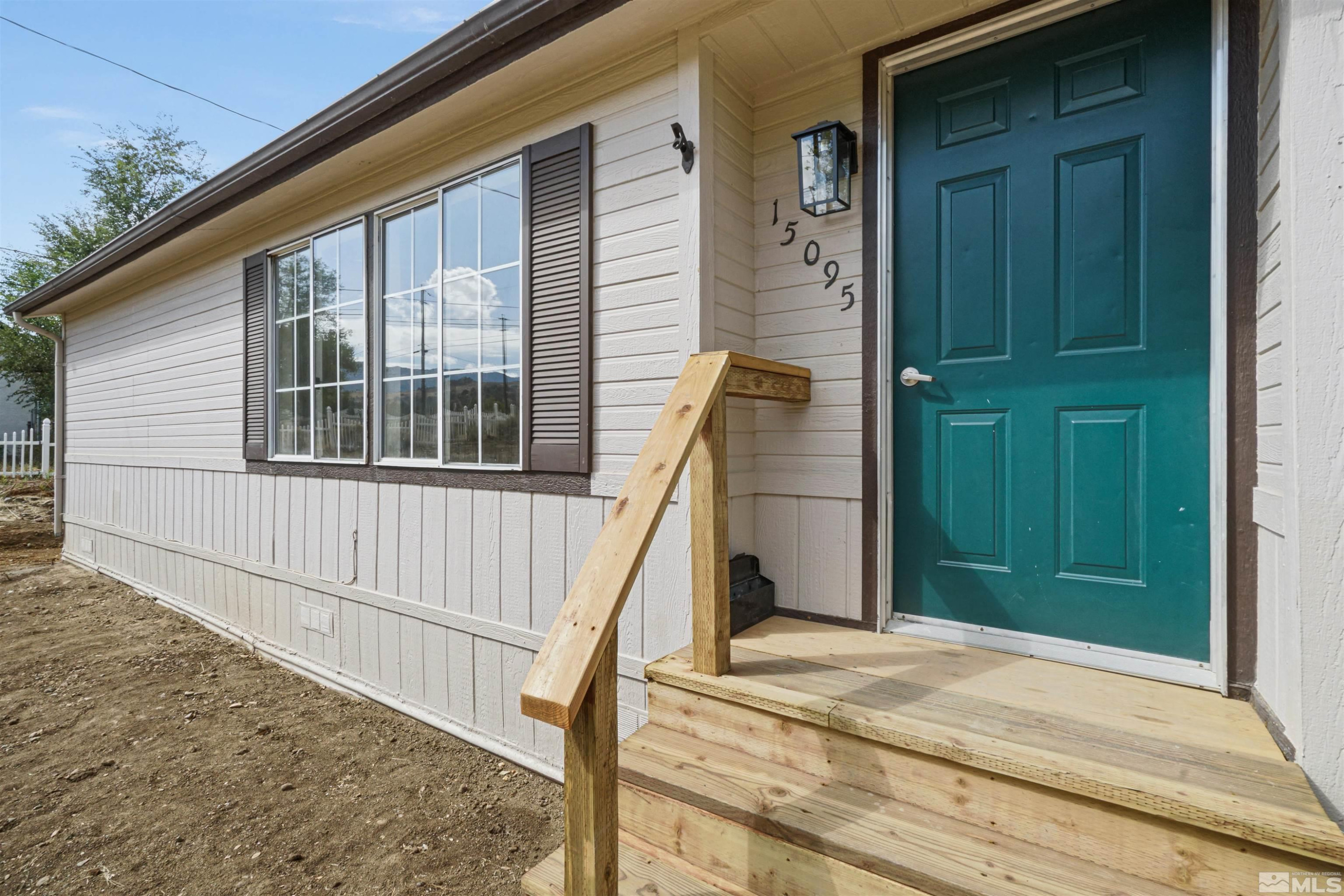 15095 Pinion Drive Reno, NV 89521 - Photo 2 of 18 a view of a house with wooden floor and stairs