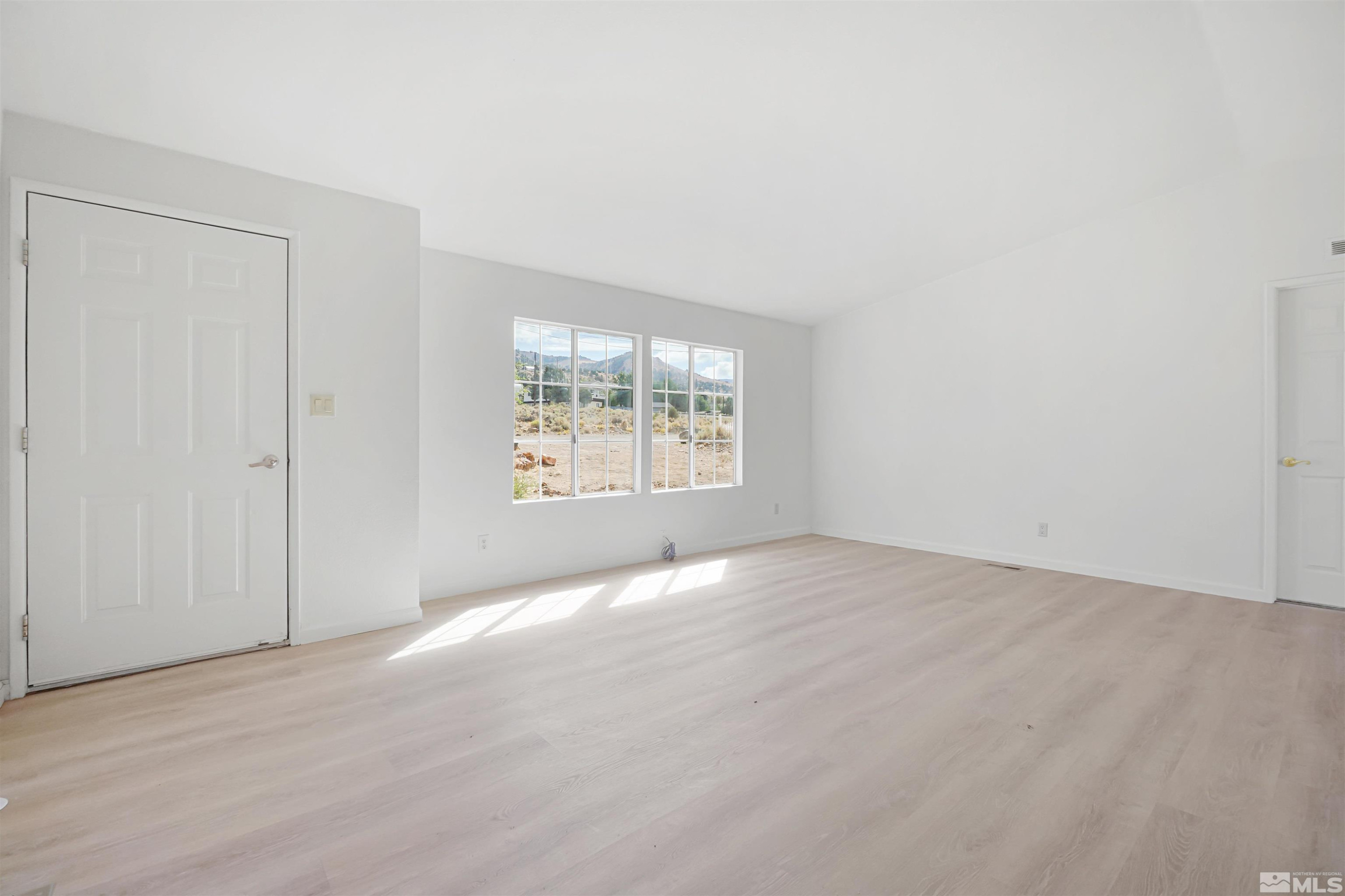 15095 Pinion Drive Reno, NV 89521 - Photo 3 of 18 an empty room with windows