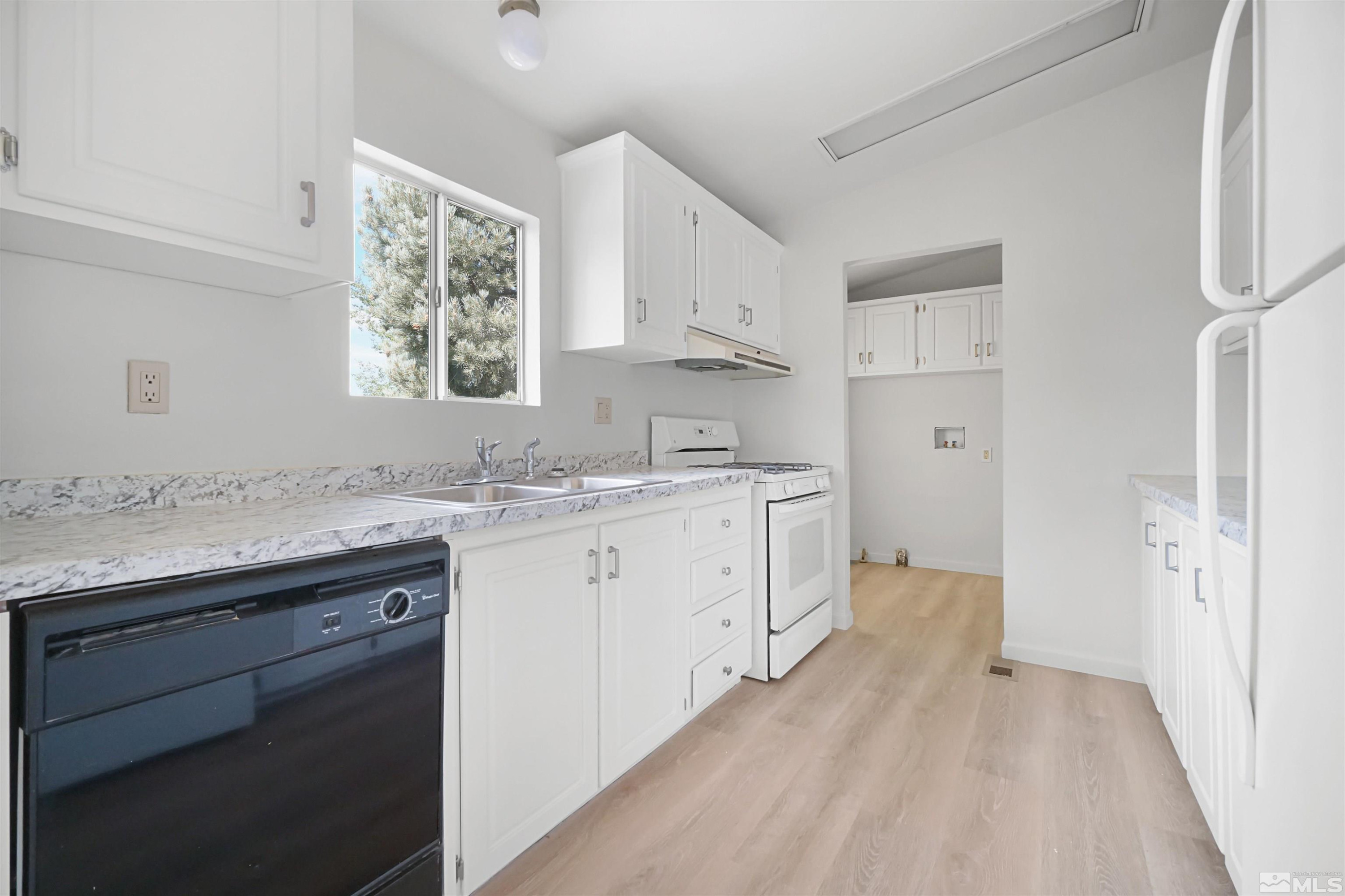 15095 Pinion Drive Reno, NV 89521 - Photo 5 of 18 a spacious bathroom with a granite countertop sink mirror and a