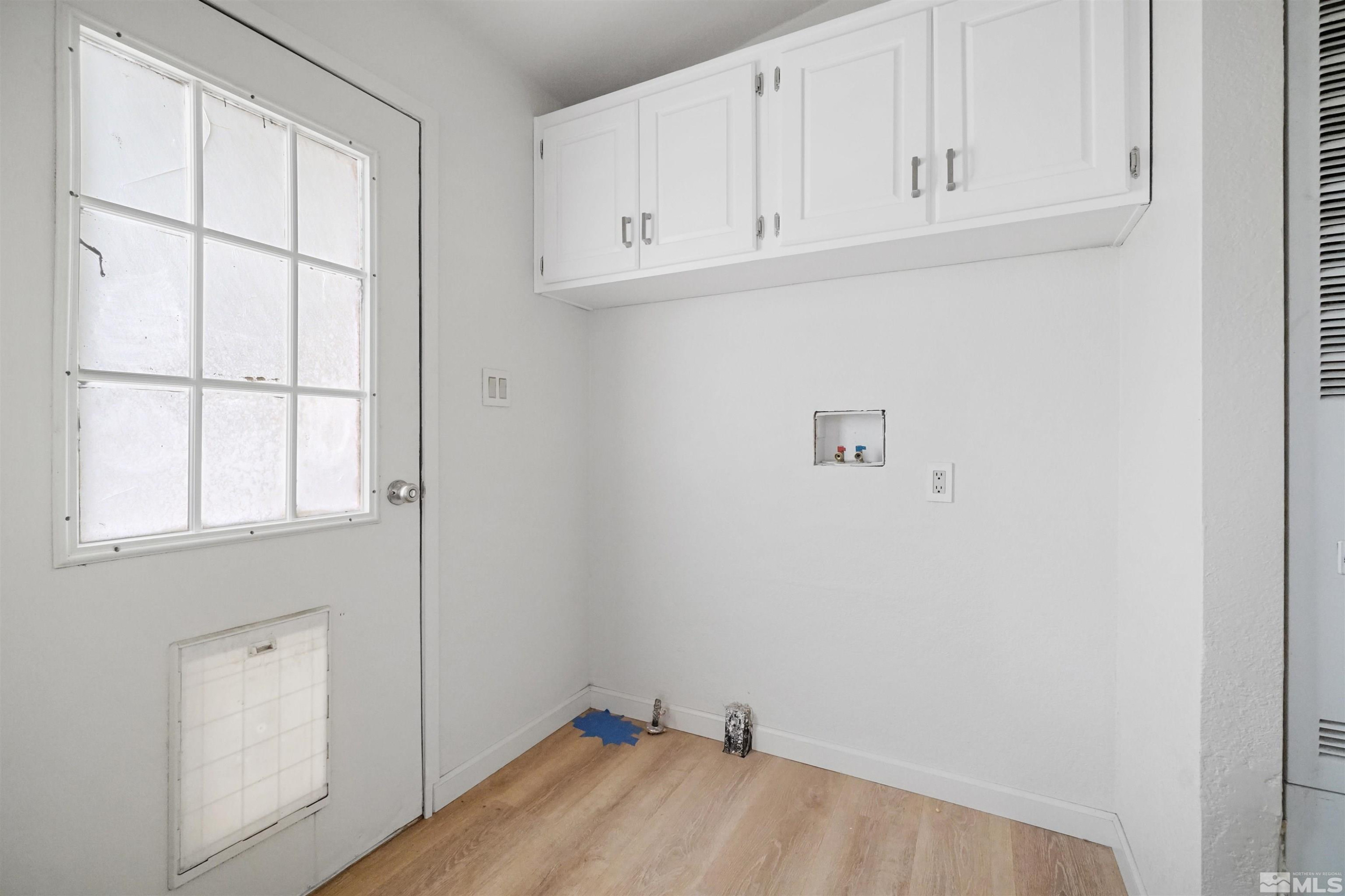 15095 Pinion Drive Reno, NV 89521 - Photo 7 of 18 a view of a closet area with wooden floor
