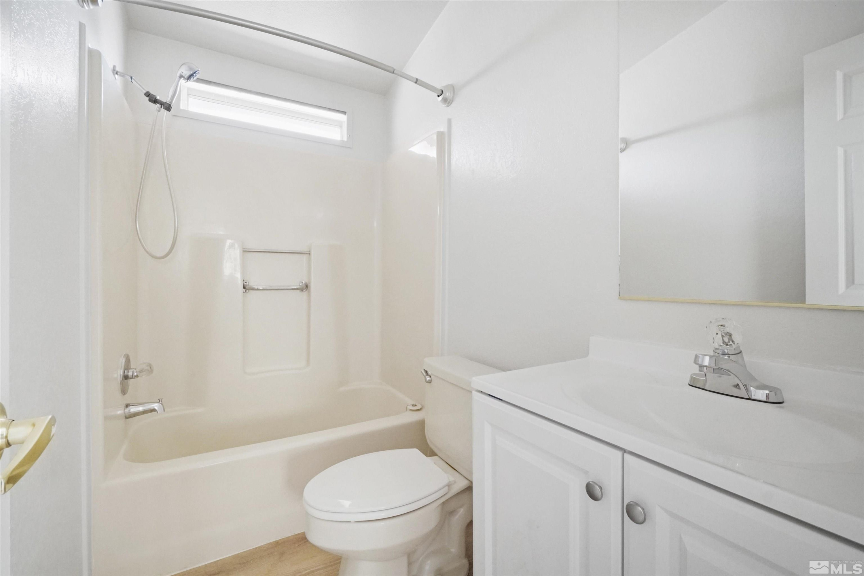15095 Pinion Drive Reno, NV 89521 - Photo 9 of 18 a bathroom with a sink toilet and shower