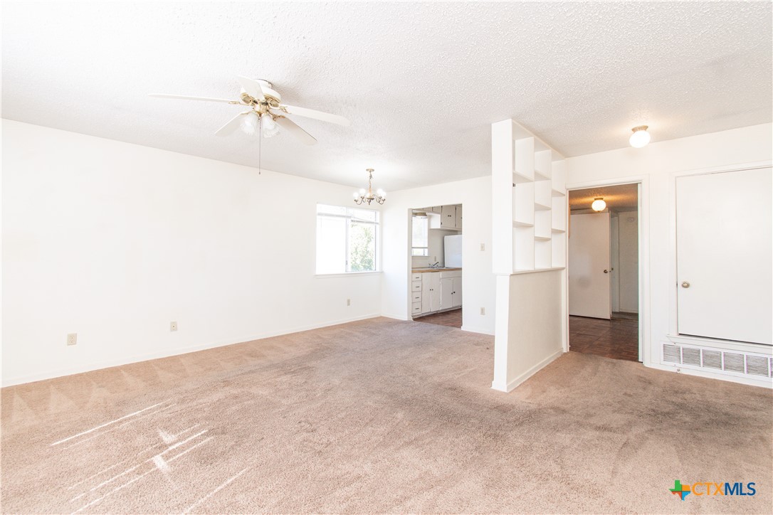 507 East Beeline Lane, Unit 3 Harker Heights, TX 76548 - Photo 2 of 13 a view of a kitchen with a refrigerator and a cabinets