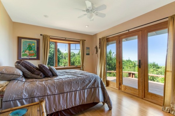 83-5366 Painted Church Road Captain Cook, HI 96704 - Photo 8 of 25 a bedroom with a bed and glass window