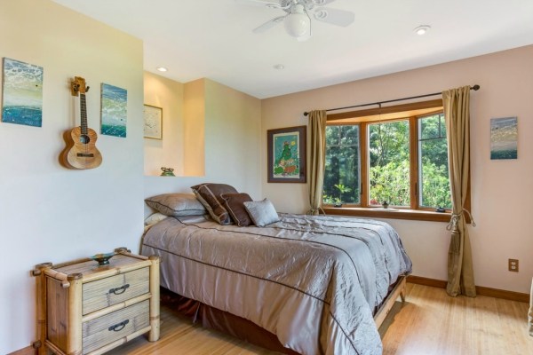 83-5366 Painted Church Road Captain Cook, HI 96704 - Photo 9 of 25 a bedroom with a bed and wooden floor