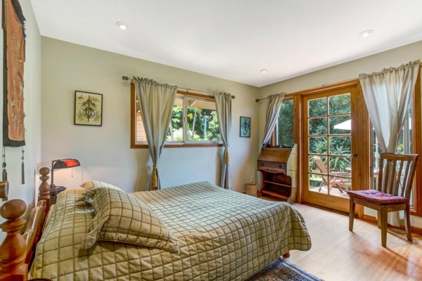 83-5366 Painted Church Road Captain Cook, HI 96704 - Photo 10 of 25 a bedroom with a bed and a large window