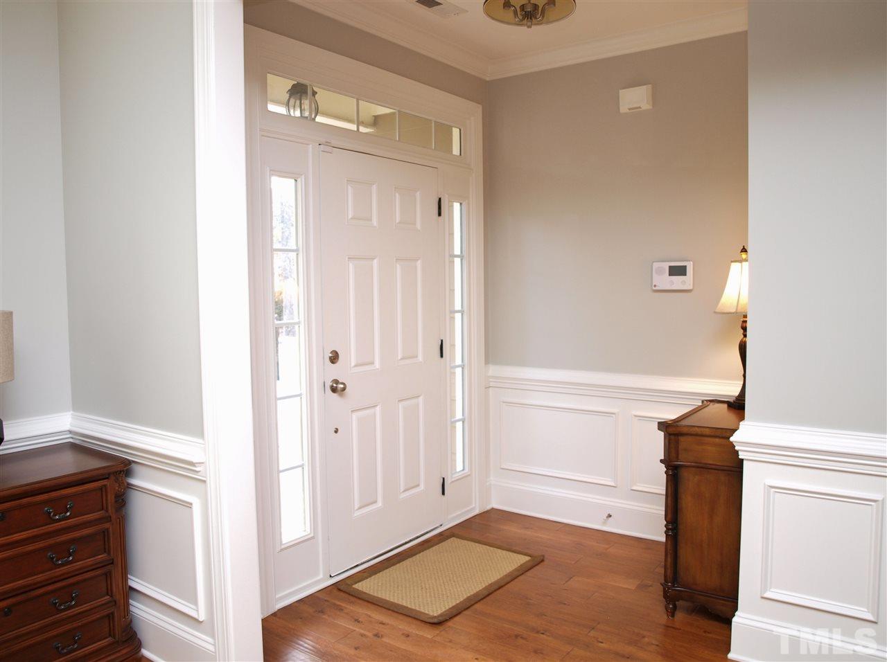300 Bon Marche Lane Raleigh, NC 27615 - Photo 2 of 25 a view of a hallway with entryway wooden floor and front door