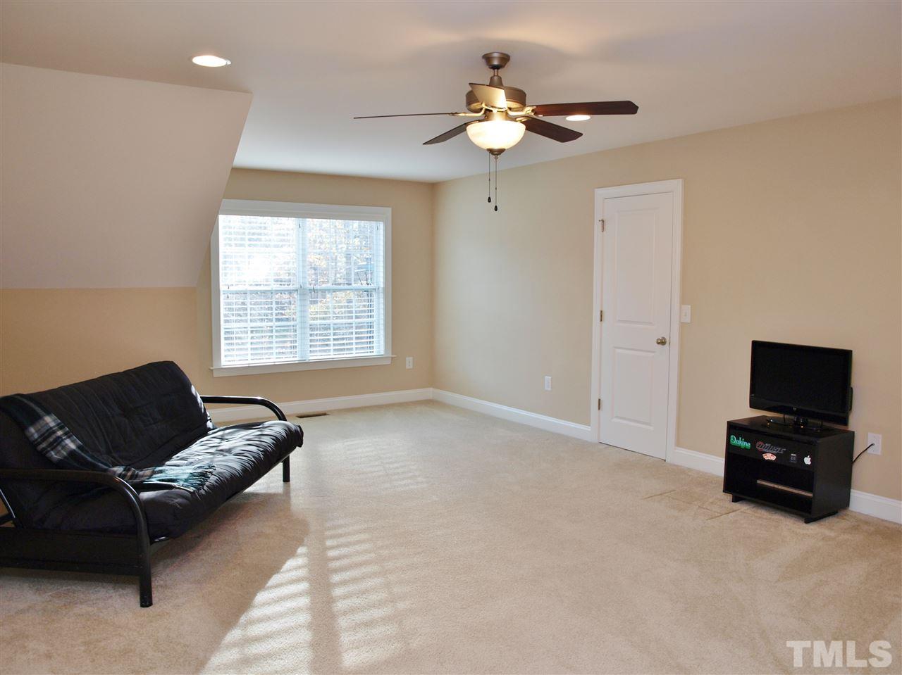 300 Bon Marche Lane Raleigh, NC 27615 - Photo 17 of 25 a living room with furniture and a flat screen tv