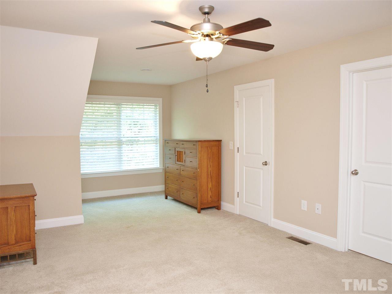 300 Bon Marche Lane Raleigh, NC 27615 - Photo 18 of 25 an empty room with windows and fan