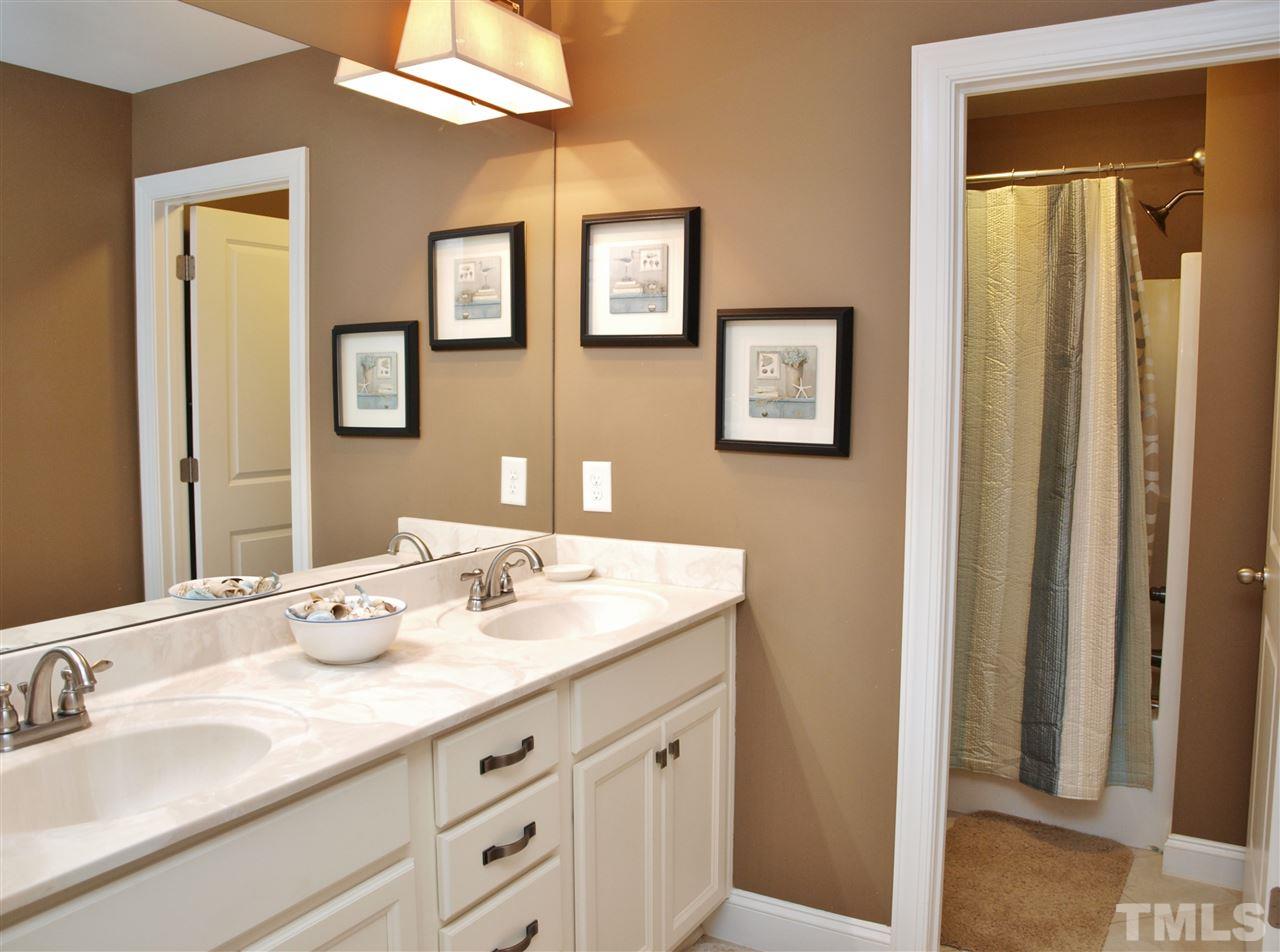 300 Bon Marche Lane Raleigh, NC 27615 - Photo 19 of 25 a bathroom with double sink and a mirror