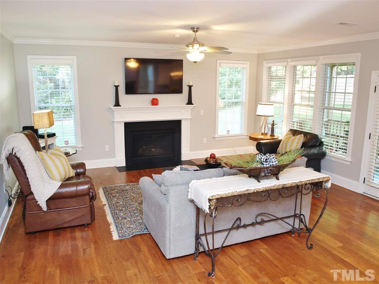 300 Bon Marche Lane Raleigh, NC 27615 - Photo 4 of 25 a living room with fireplace furniture and a flat screen tv