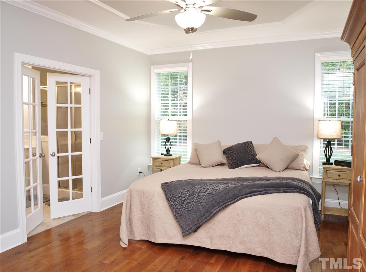 300 Bon Marche Lane Raleigh, NC 27615 - Photo 9 of 25 a bedroom with a large bed and a window