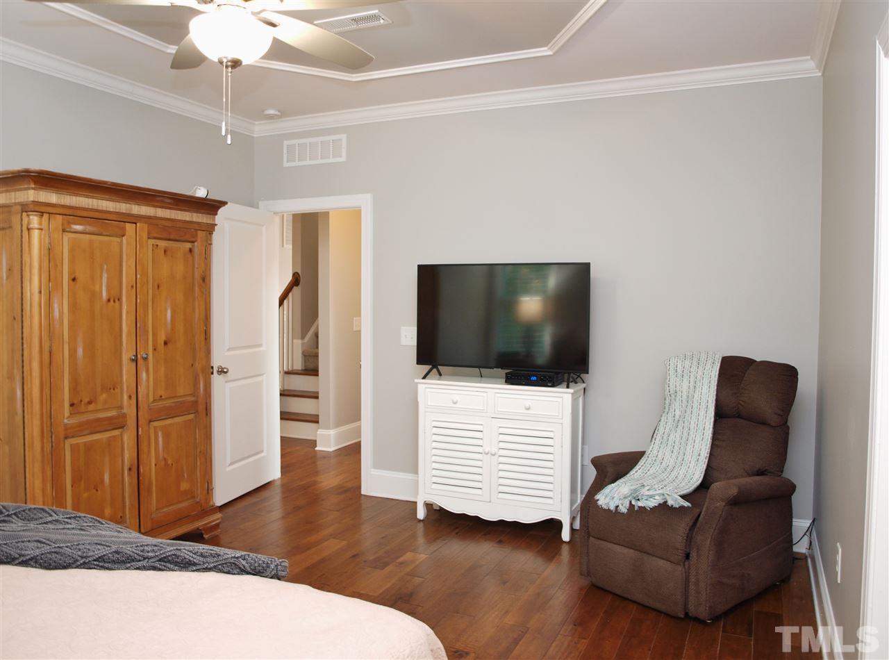 300 Bon Marche Lane Raleigh, NC 27615 - Photo 10 of 25 a living room with furniture and a flat screen tv