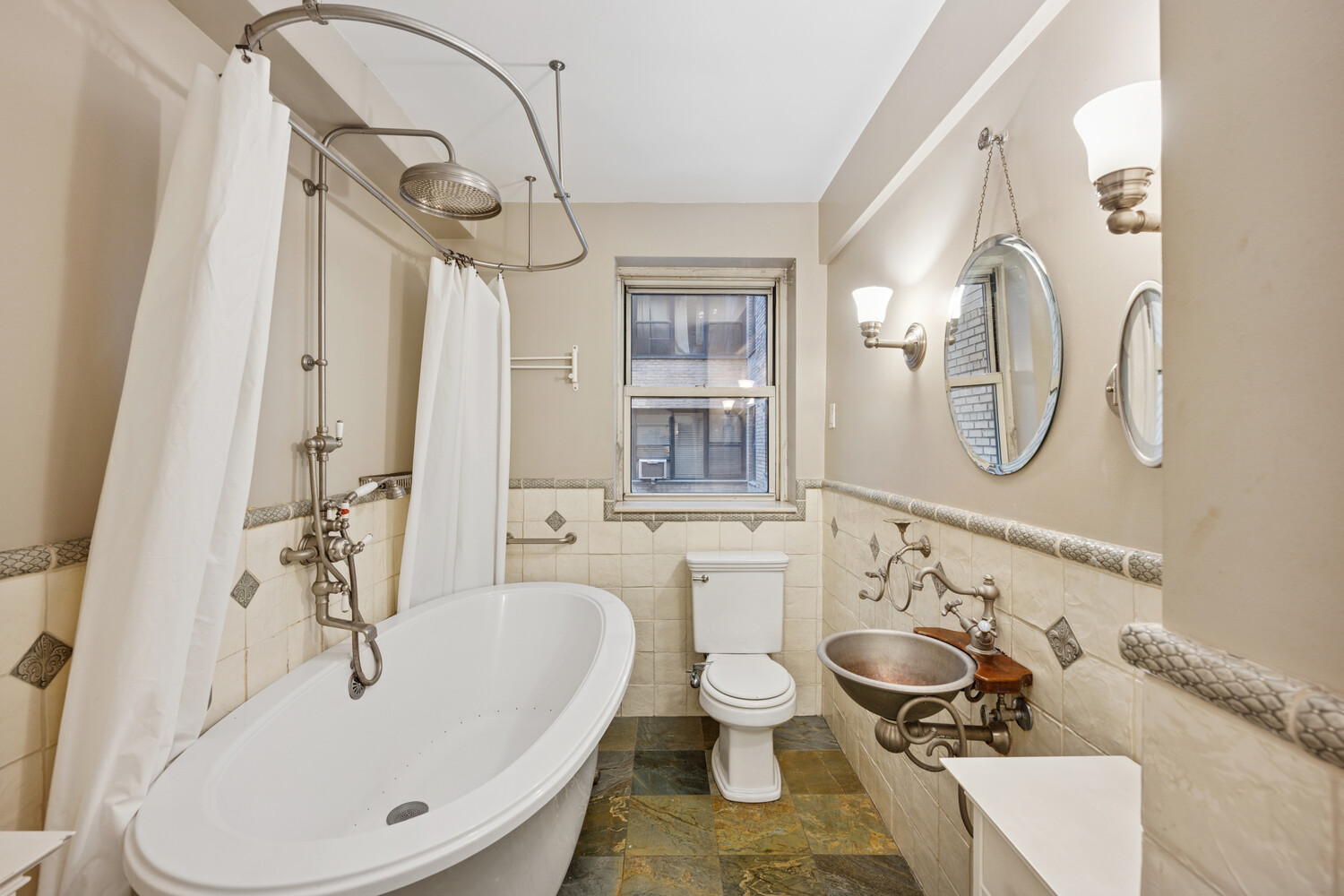 424 East 52nd Street, Unit 2D Manhattan, NY 10022 - Photo 10 of 17 a bathroom with a sink and a mirror