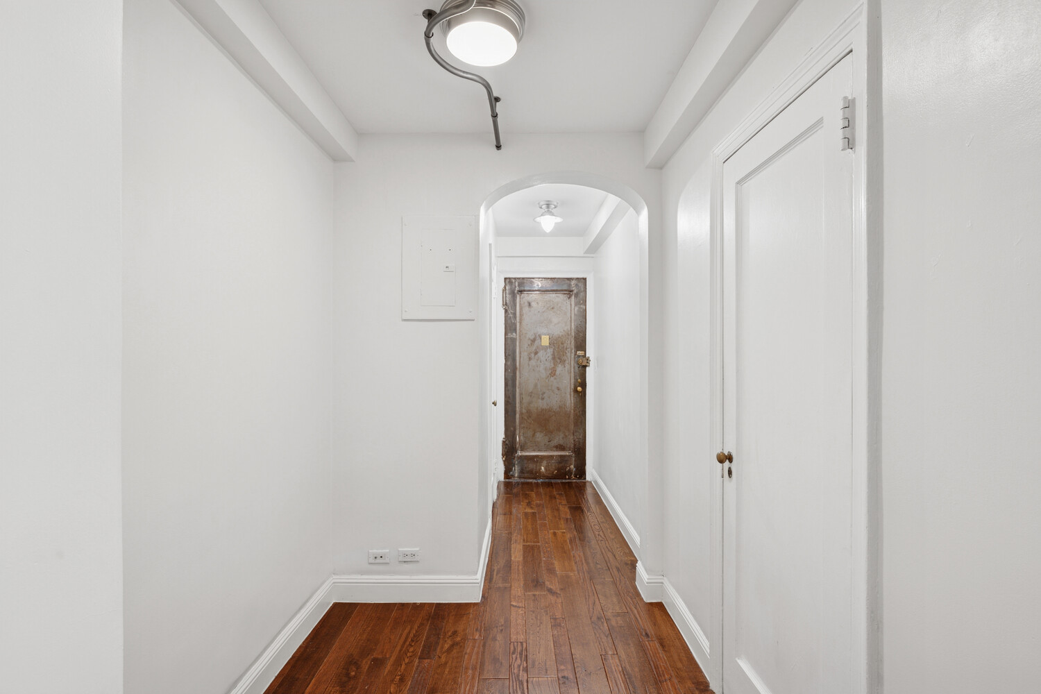 424 East 52nd Street, Unit 2D Manhattan, NY 10022 - Photo 12 of 17 a view of a hallway with wooden floor