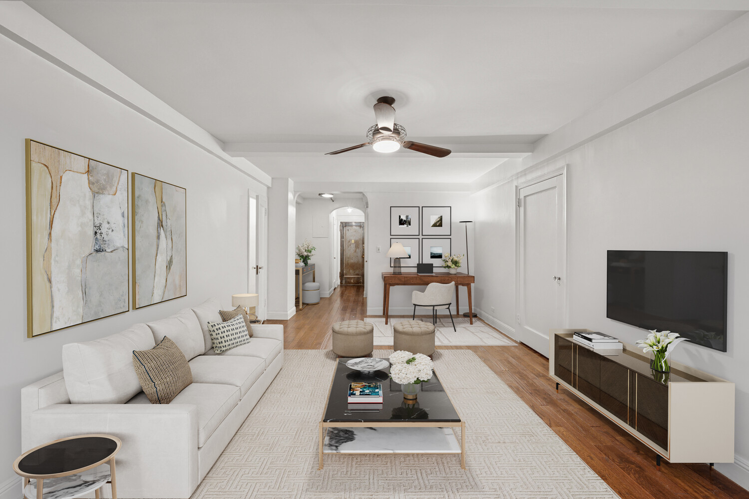 424 East 52nd Street, Unit 2D Manhattan, NY 10022 - Photo 6 of 17 a living room with furniture and a flat screen tv