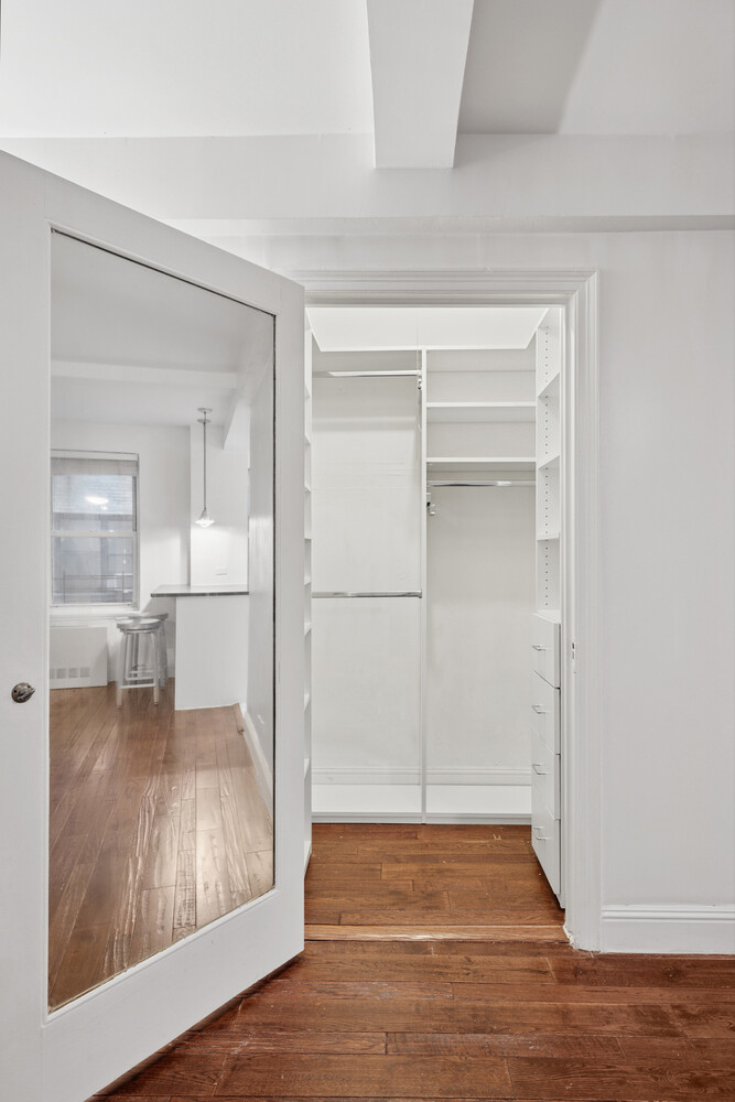 424 East 52nd Street, Unit 2D Manhattan, NY 10022 - Photo 8 of 17 a view of empty room with wooden floor