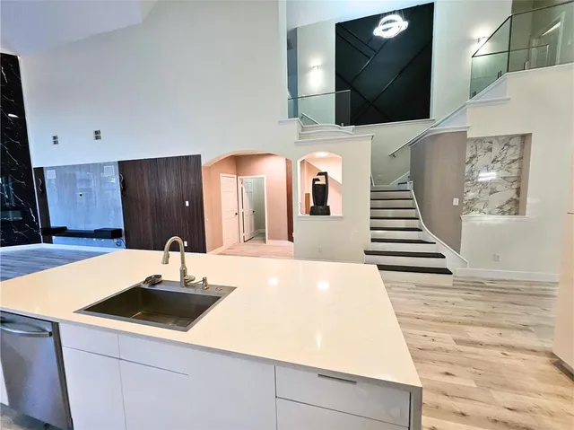 a view of empty room with floor to ceiling window and pool table